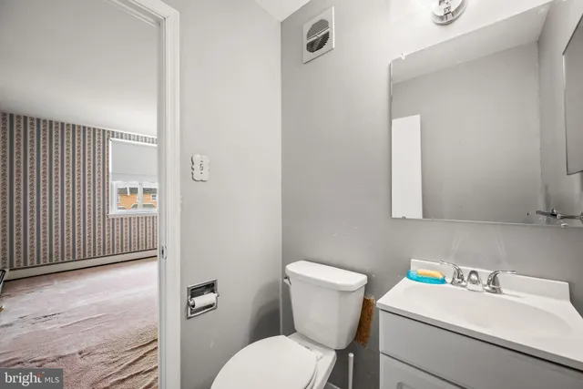 a view of a hallway with staircase