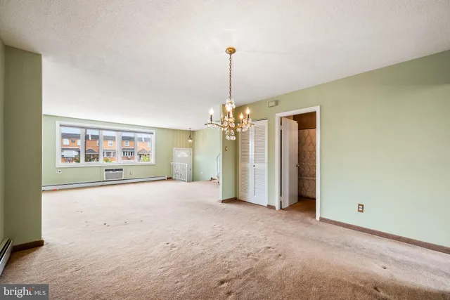 a kitchen with a stove a sink and a microwave
