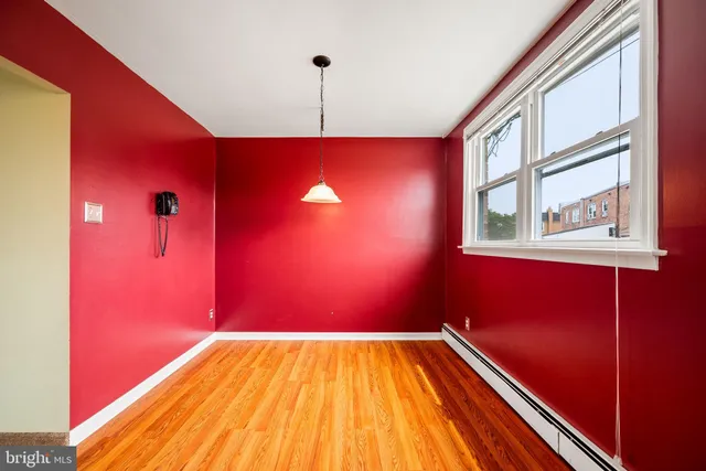 a kitchen with stainless steel appliances granite countertop a stove and a wooden floors