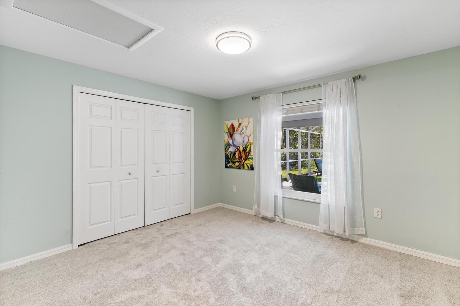 149 Big Springs Drive Naples, FL 34113 - Photo 16 of 35 an empty room with windows