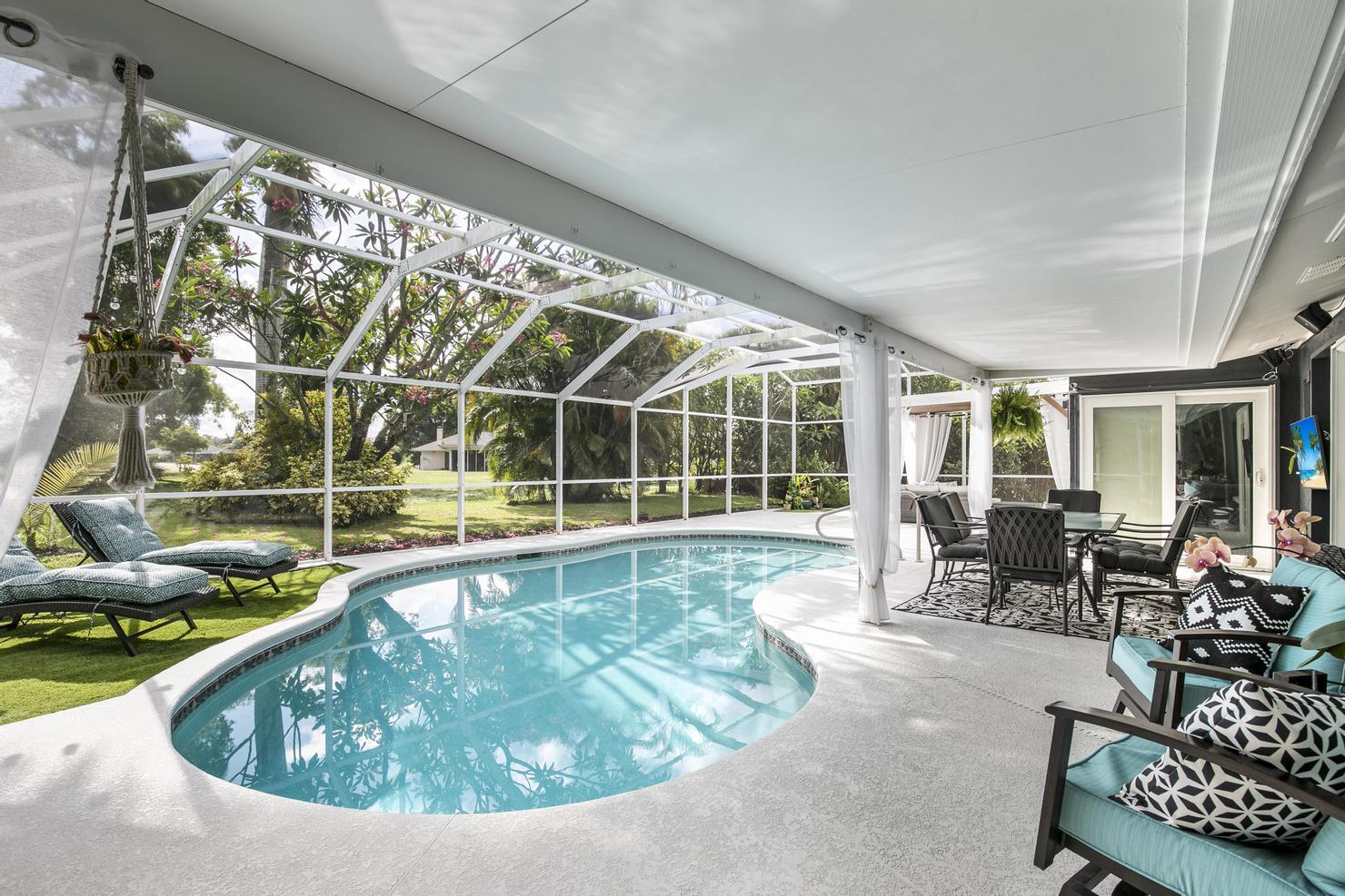 149 Big Springs Drive Naples, FL 34113 - Photo 2 of 35 a view of swimming pool with outdoor seating