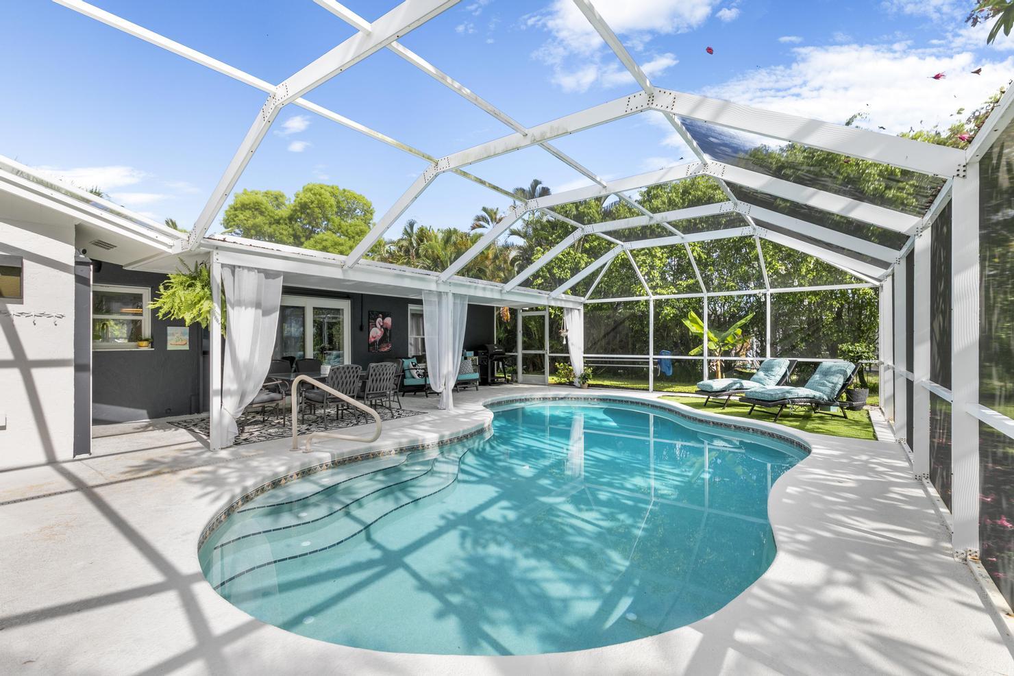 149 Big Springs Drive Naples, FL 34113 - Photo 21 of 35 a view of a house with swimming pool