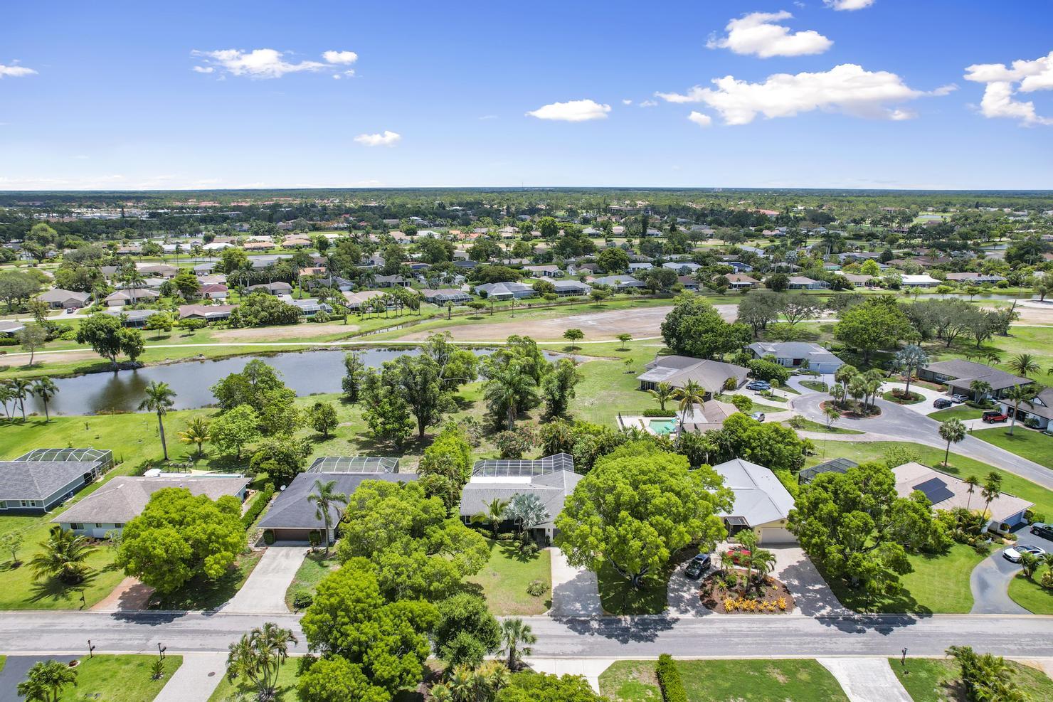 149 Big Springs Drive Naples, FL 34113 - Photo 30 of 35 an aerial view of residential houses with outdoor space