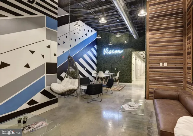 a lobby with furniture and wooden floor