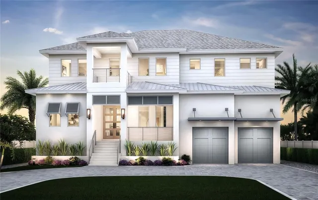 a front view of a house with a yard and potted plants