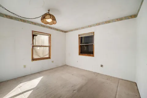 an empty room with window