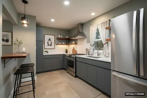 a bedroom with bed and a window