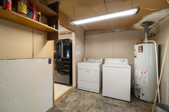 a view of storage and utility room with washer and dryer