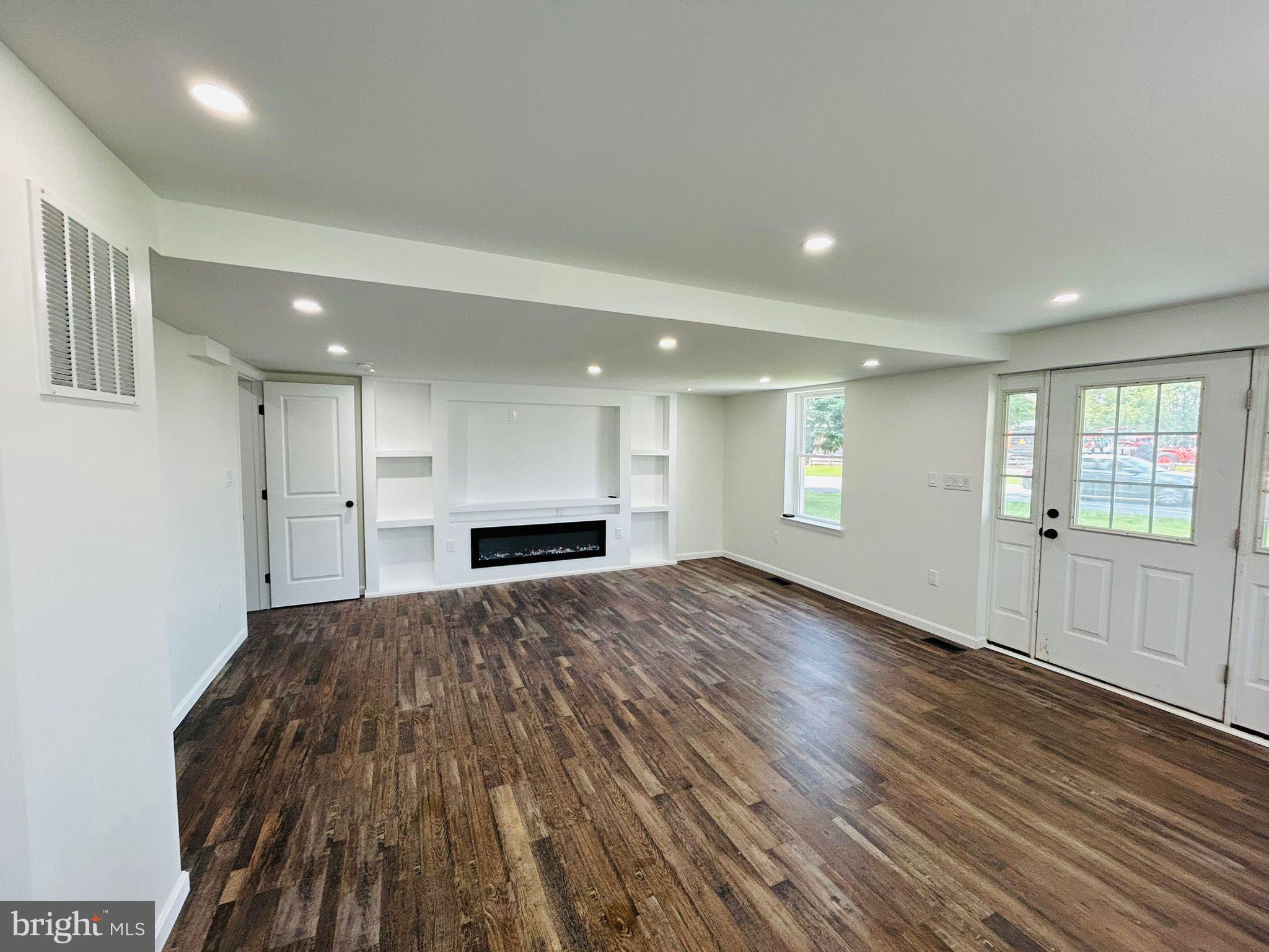9647 Liberty Road Frederick, MD 21701 - Photo 7 of 14 a view of empty room with wooden floor