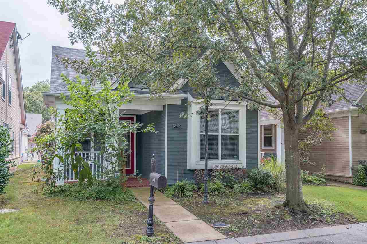 1448 Island Town Cove Memphis, TN 38103 - Photo 1 of 18 a front view of a house with garden