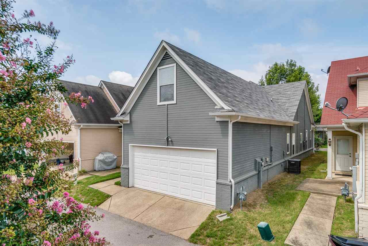 1448 Island Town Cove Memphis, TN 38103 - Photo 15 of 18 a front view of a house with a yard