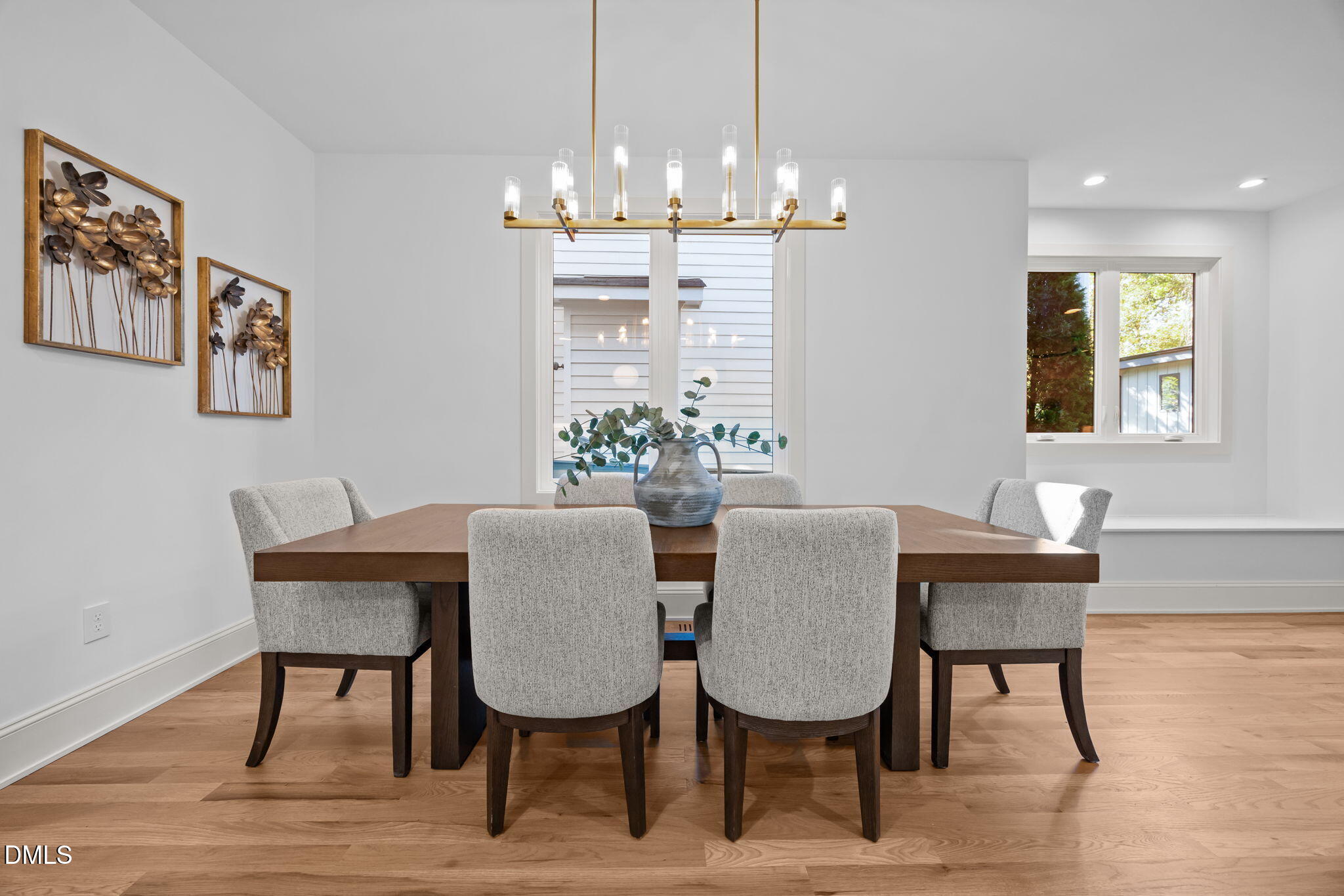 805 Tower Street, Unit 101 Raleigh, NC 27607 - Photo 12 of 38 a view of a dining room with furniture and wooden floor