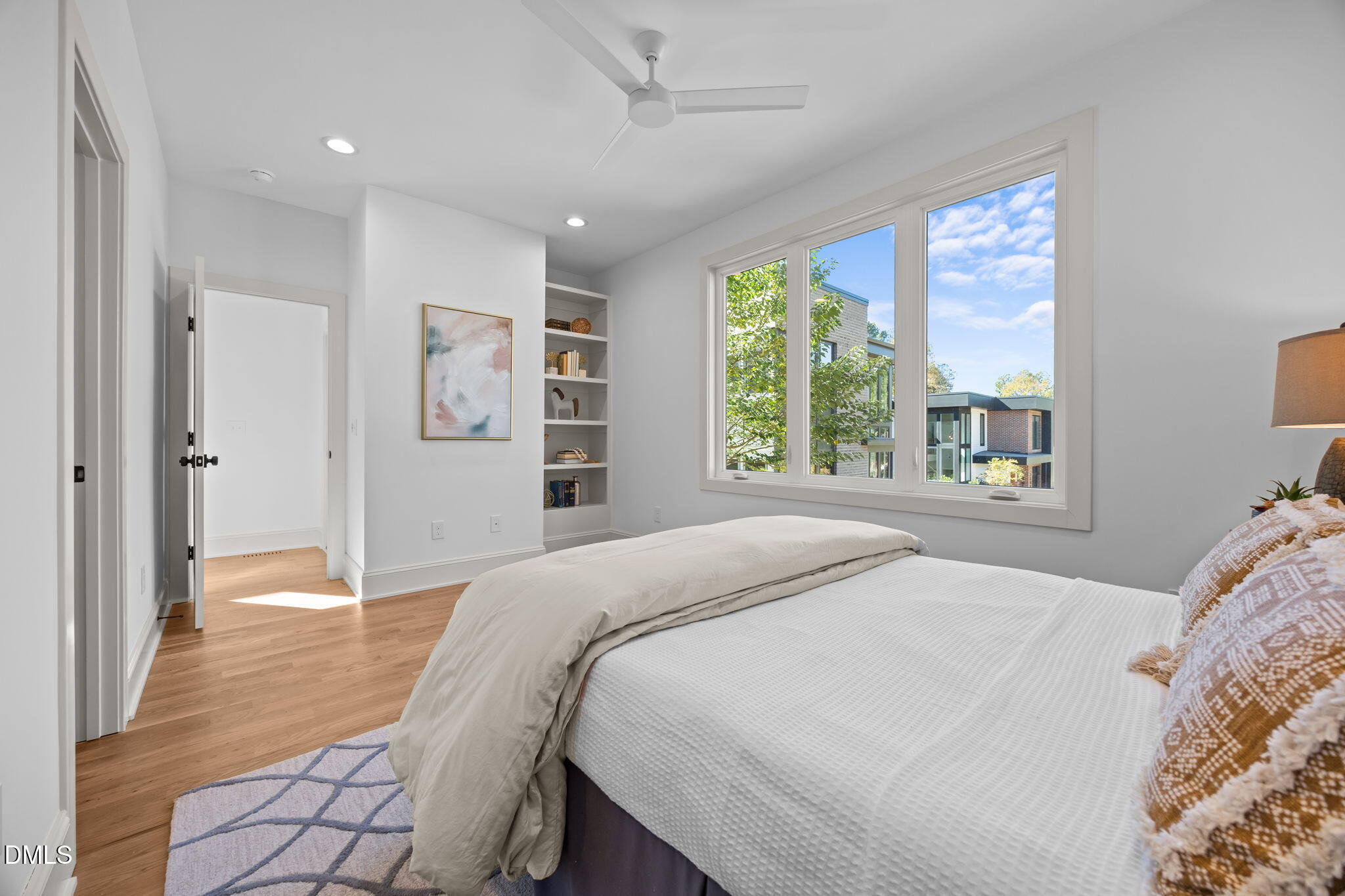 805 Tower Street, Unit 101 Raleigh, NC 27607 - Photo 16 of 38 a bedroom with a large bed and a window