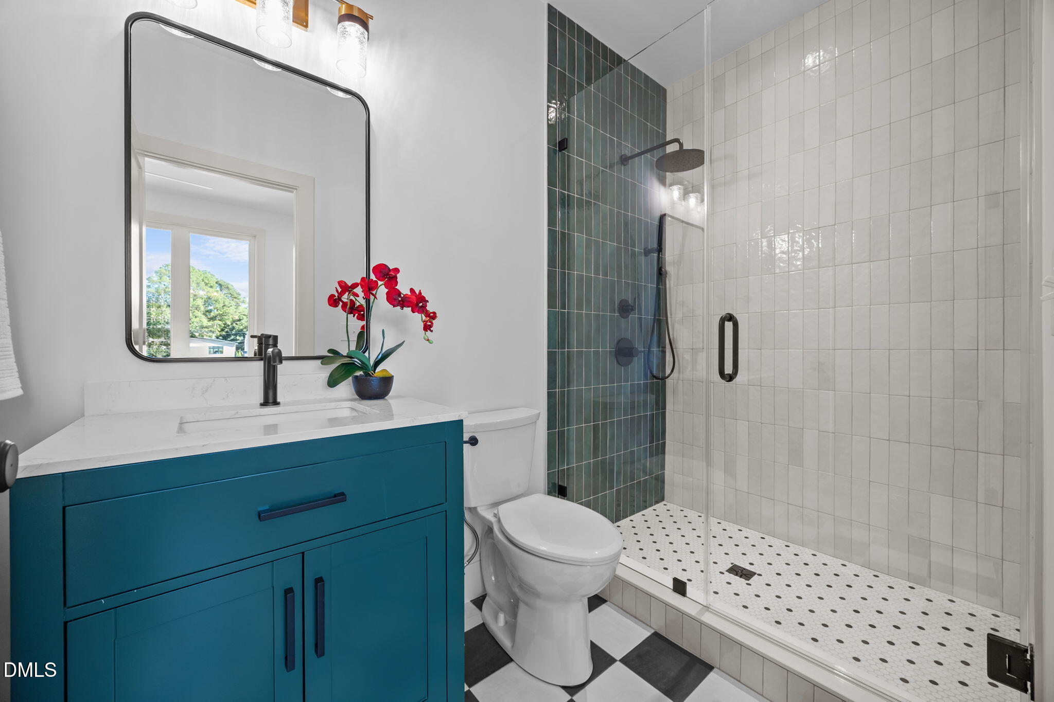 805 Tower Street, Unit 101 Raleigh, NC 27607 - Photo 17 of 38 a bathroom with a sink toilet and shower