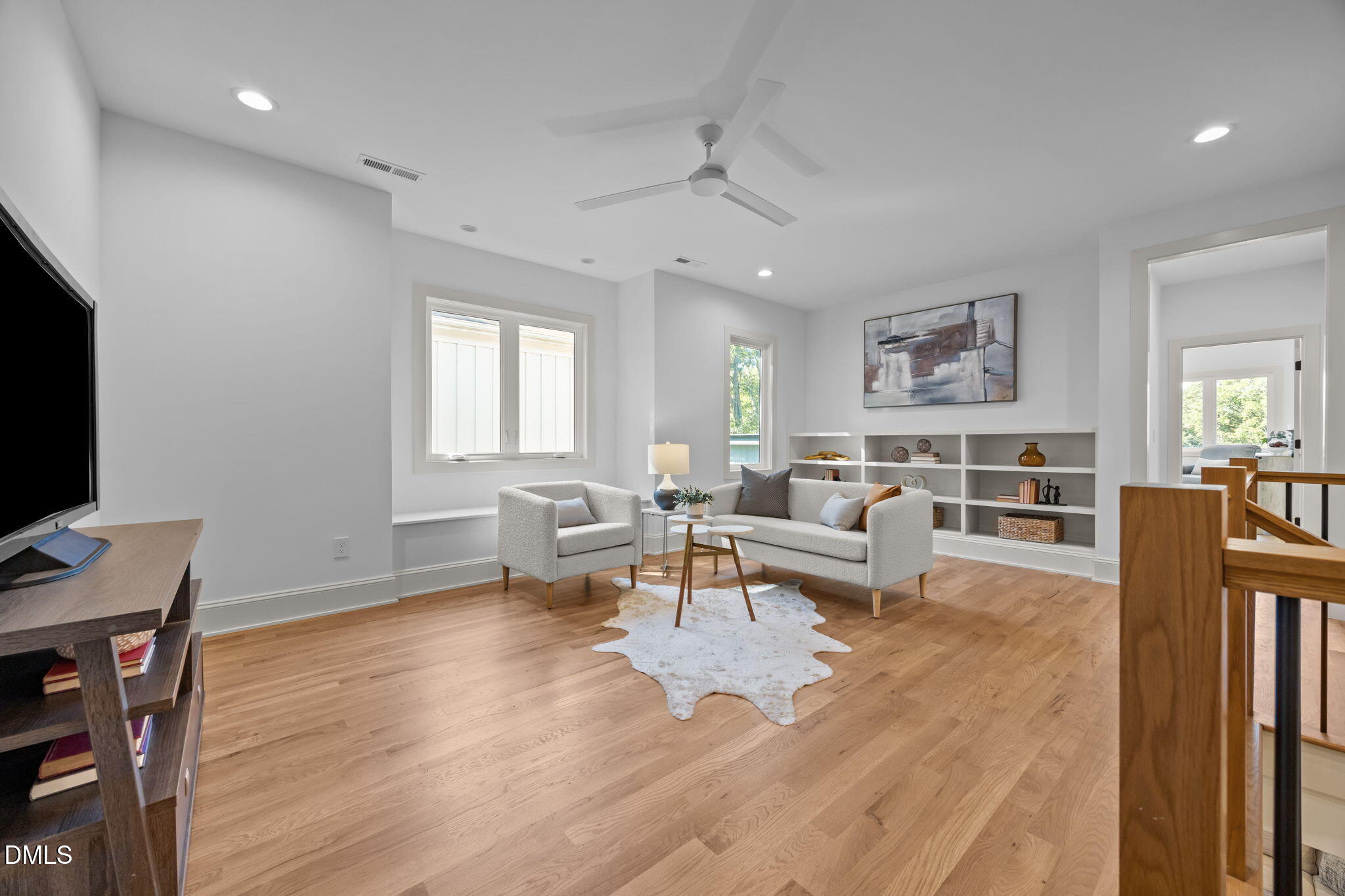805 Tower Street, Unit 101 Raleigh, NC 27607 - Photo 18 of 38 a living room with fireplace furniture and a flat screen tv