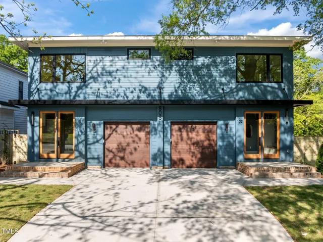 a front view of a building with garden