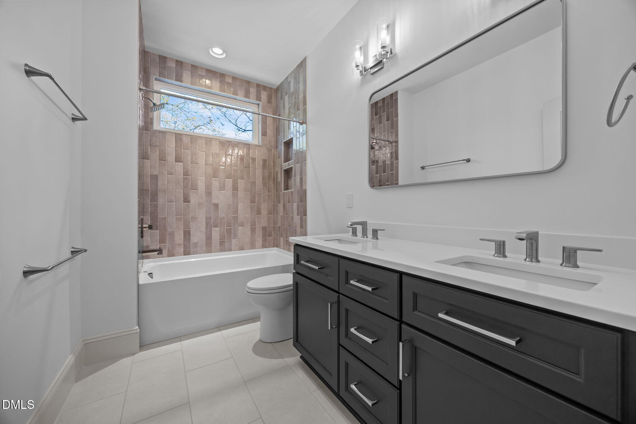 805 Tower Street, Unit 101 Raleigh, NC 27607 - Photo 27 of 38 a bathroom with a granite countertop sink toilet a large mirror and shower