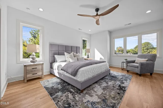 a bathroom with a shower sink vanity granite and mirror