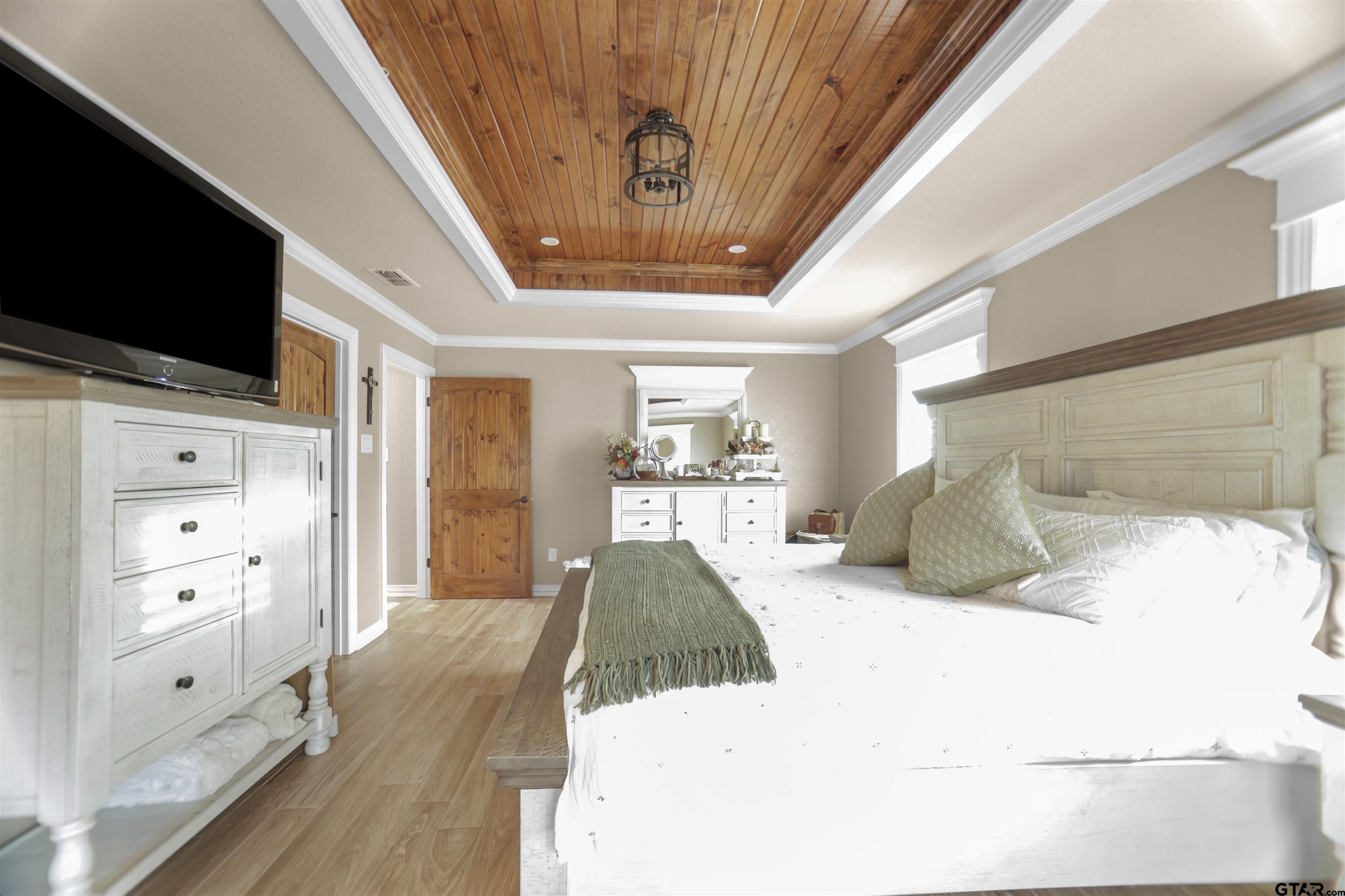 11931 State Highway 64 Tyler, TX 75704 - Photo 11 of 44 a large white bed in a white room
