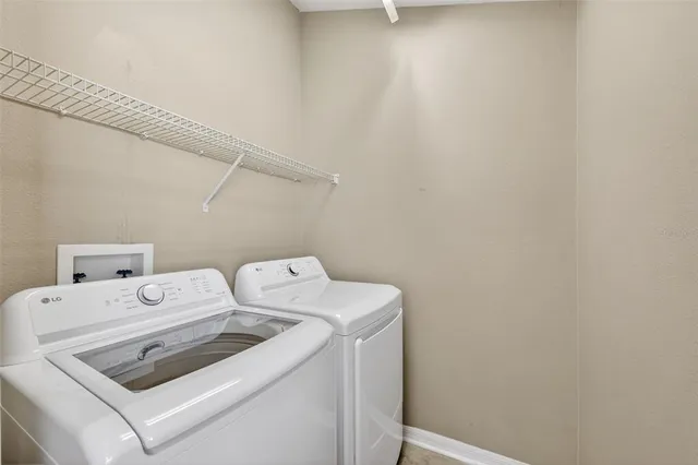 a utility room with dryer and washer