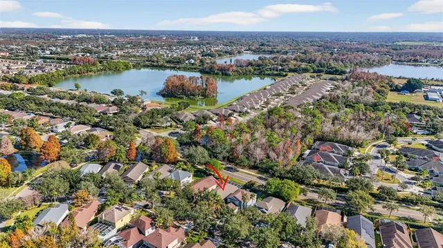 an aerial view of city and lake