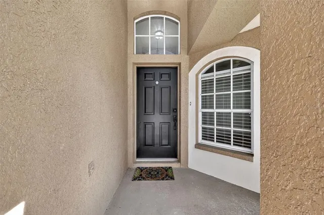 a front view of a house with a large window