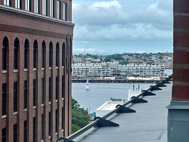 a kitchen with stainless steel appliances granite countertop a sink and a stove