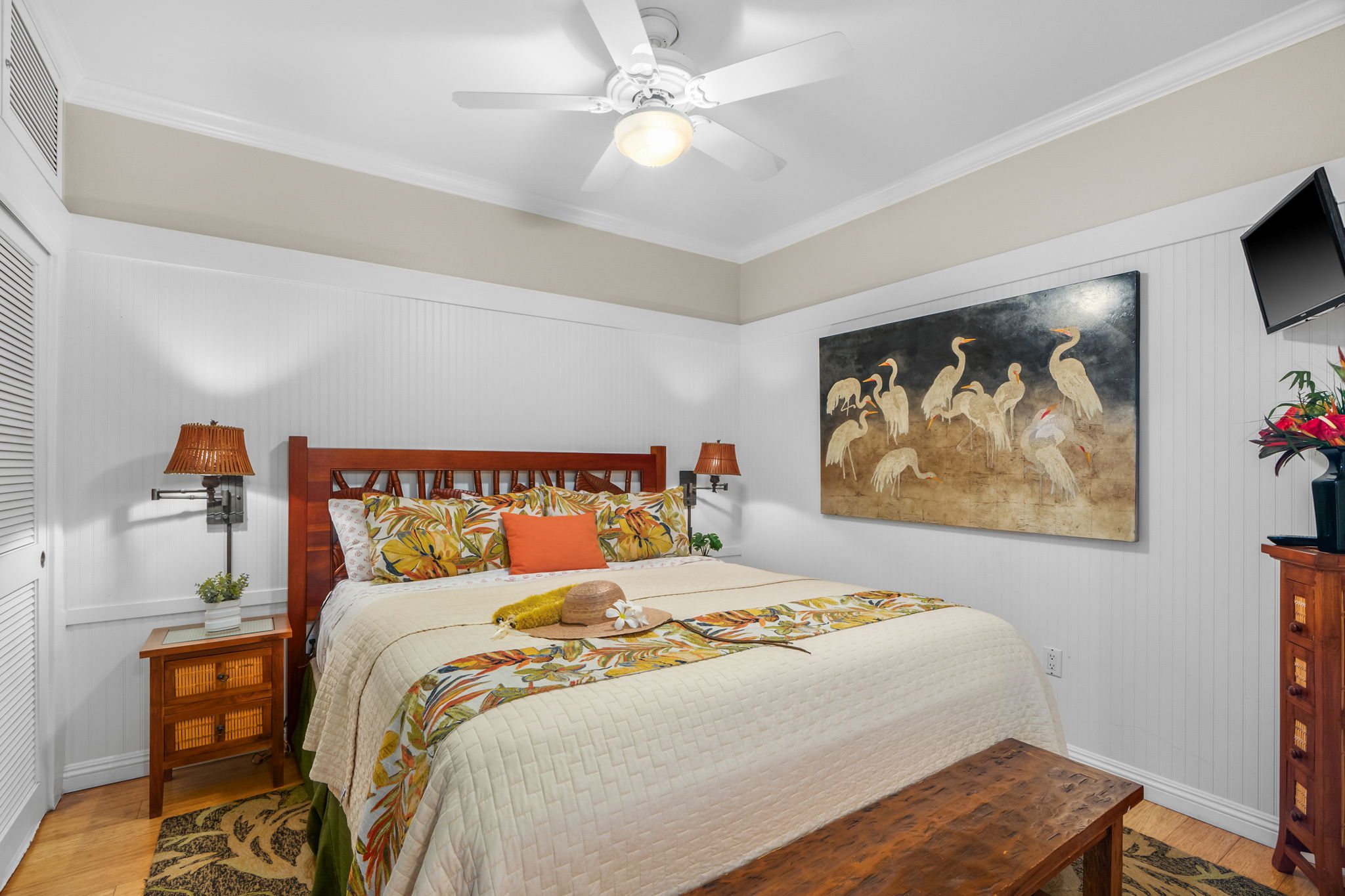 2253 Poipu Road, Unit 26 Koloa, HI 96756 - Photo 11 of 21 a bedroom with a bed and a wall painting