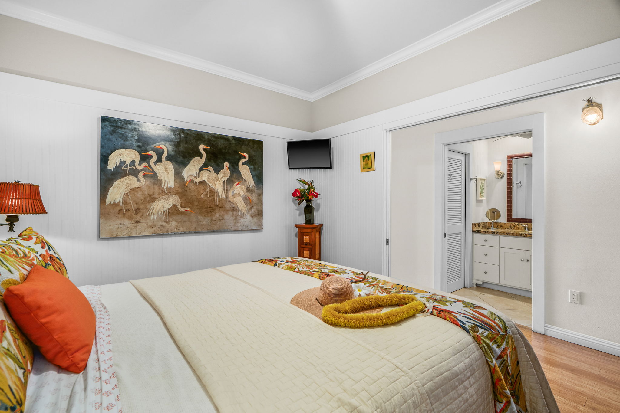 2253 Poipu Road, Unit 26 Koloa, HI 96756 - Photo 12 of 21 a bedroom with a bed and painting on the wall