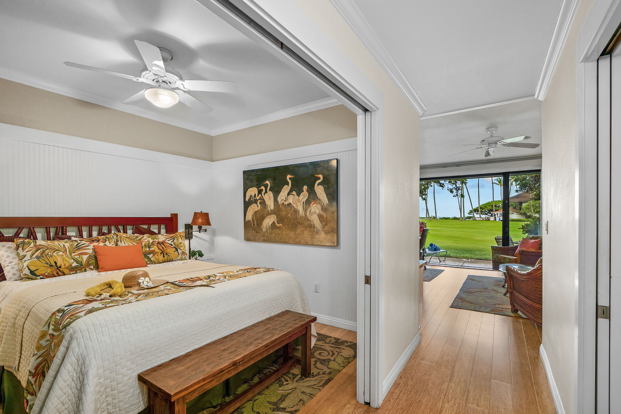 2253 Poipu Road, Unit 26 Koloa, HI 96756 - Photo 13 of 21 a bedroom with a bed and a chandelier