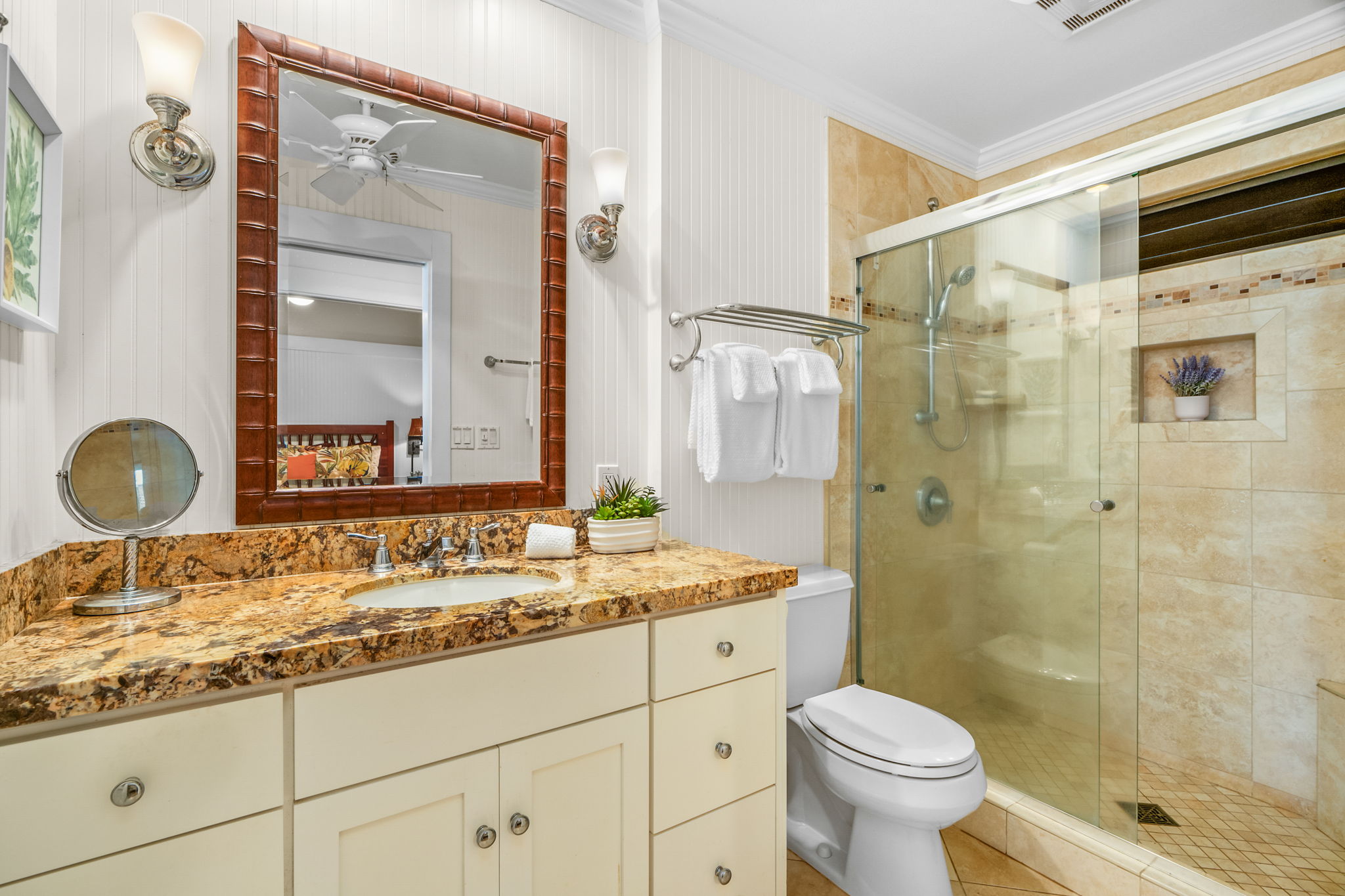 2253 Poipu Road, Unit 26 Koloa, HI 96756 - Photo 14 of 21 a bathroom with a granite countertop sink toilet mirror and shower