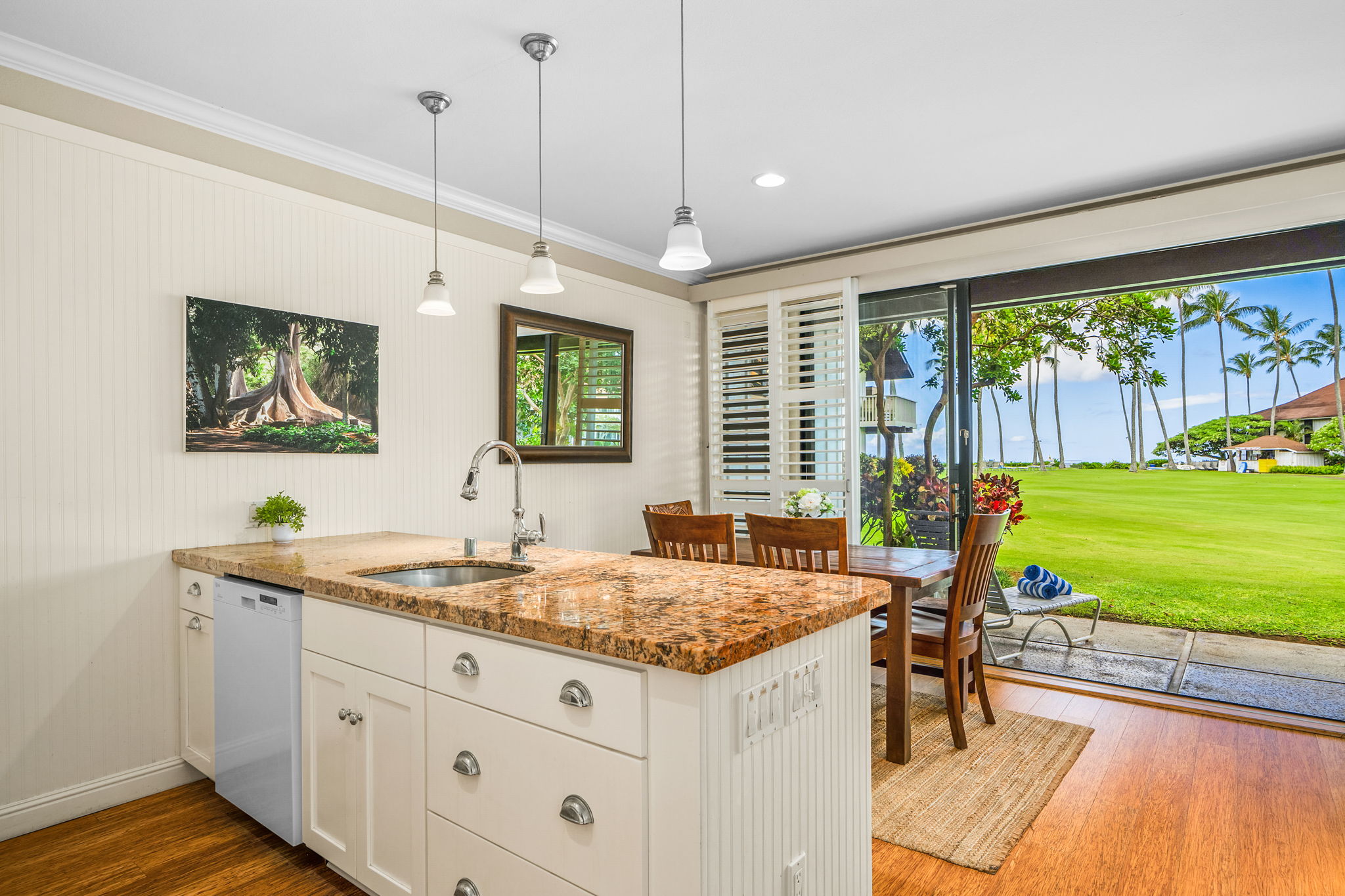 2253 Poipu Road, Unit 26 Koloa, HI 96756 - Photo 6 of 21 a bathroom with a granite countertop sink and a large window