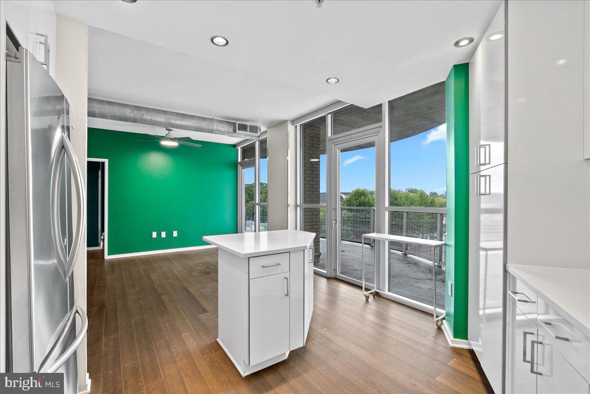 3409 Wilson Boulevard, Unit 412 Arlington, VA 22201 - Photo 12 of 19 a living room with furniture and a large window