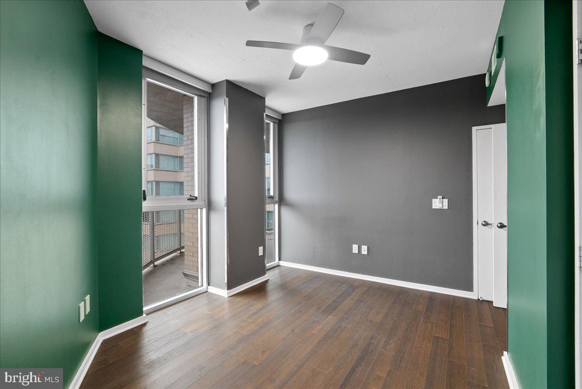 3409 Wilson Boulevard, Unit 412 Arlington, VA 22201 - Photo 17 of 19 wooden floor in an empty room with a window