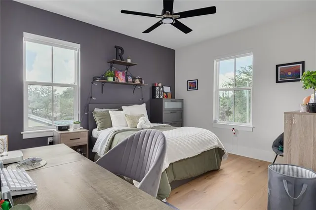 a bedroom with a bed and a window