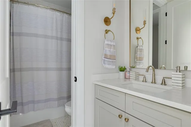 a bathroom with a double vanity sink and mirror
