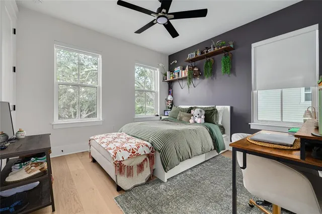 a bedroom with a bed and window