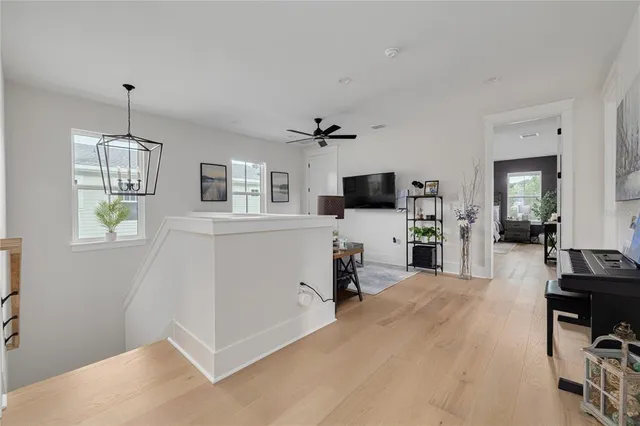 a view of a kitchen with microwave and furniture