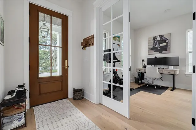 a view of a livingroom with workspace and a window