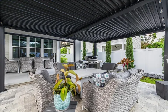 a view of an outdoor sitting area with furniture and garden view