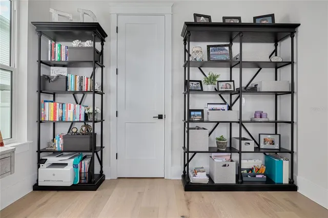 a view of an entryway with wooden floor