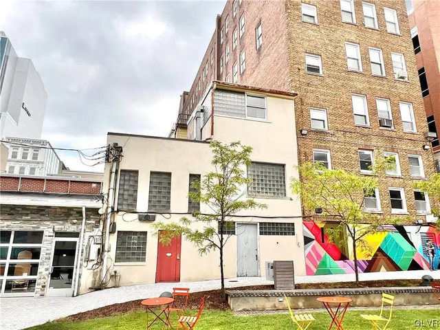a view of a building with sitting area