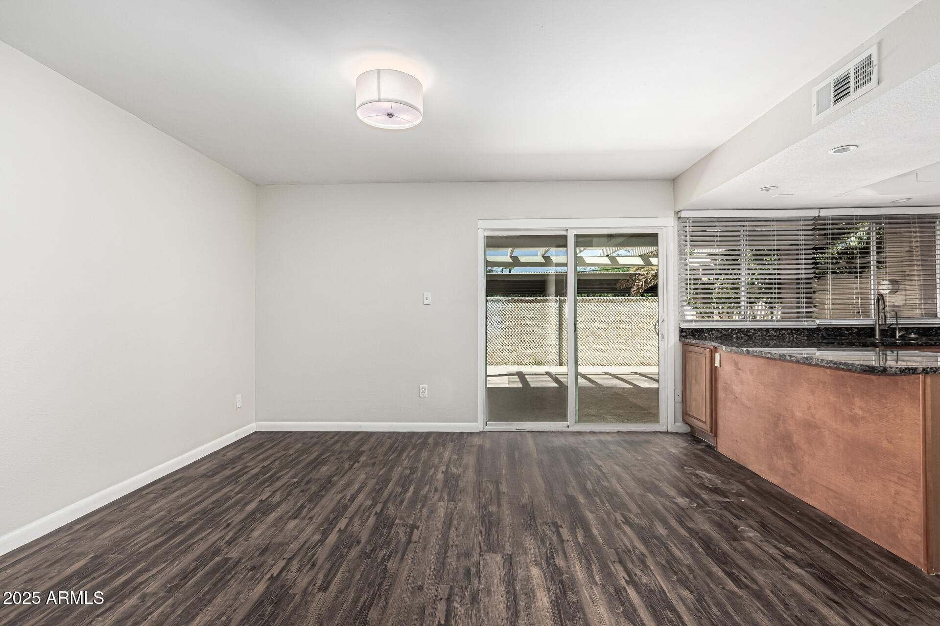 5815 East Thomas Road Scottsdale, AZ 85251 - Photo 5 of 19 a view of a room with wooden floor and iron gate