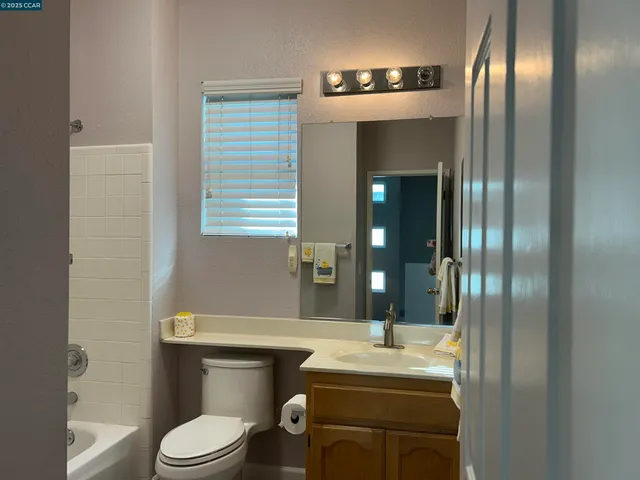 a bathroom with a sink and cabinets