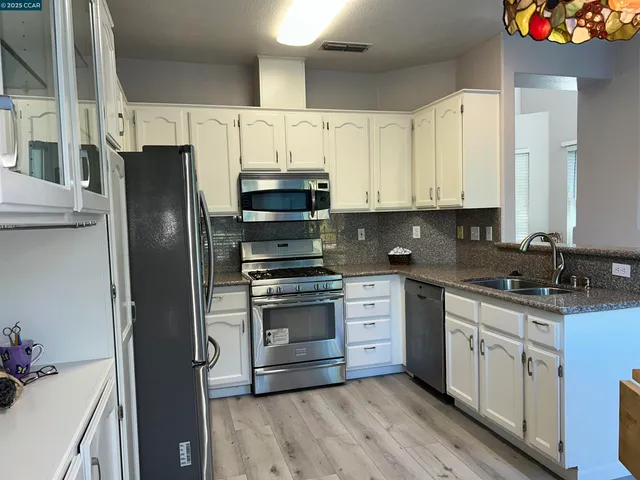 a bathroom with a sink toilet and mirror