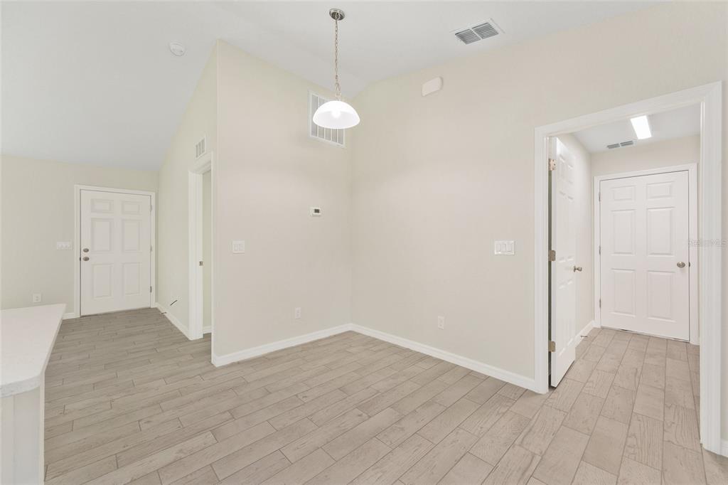 360 Locust Road Ocala, FL 34472 - Photo 17 of 48 a view of an empty room with wooden floor