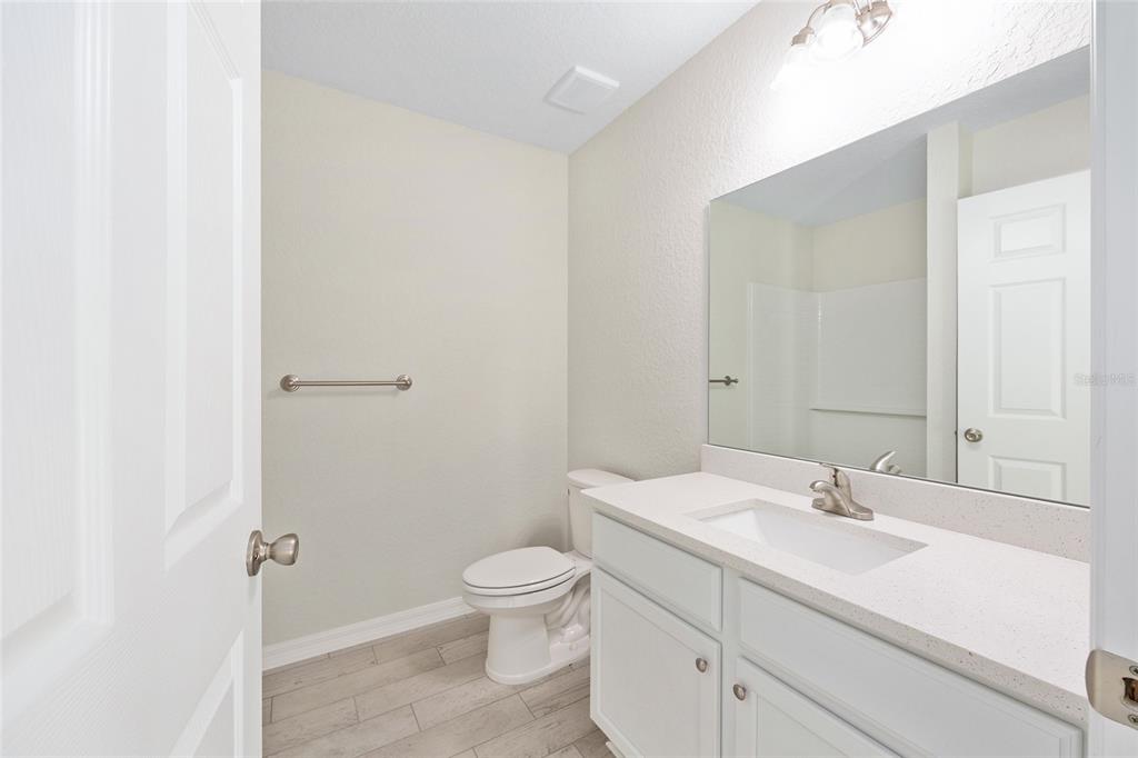 360 Locust Road Ocala, FL 34472 - Photo 25 of 48 a bathroom with a sink a toilet and shower