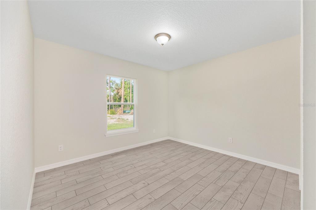 360 Locust Road Ocala, FL 34472 - Photo 29 of 48 a view of an empty room and window
