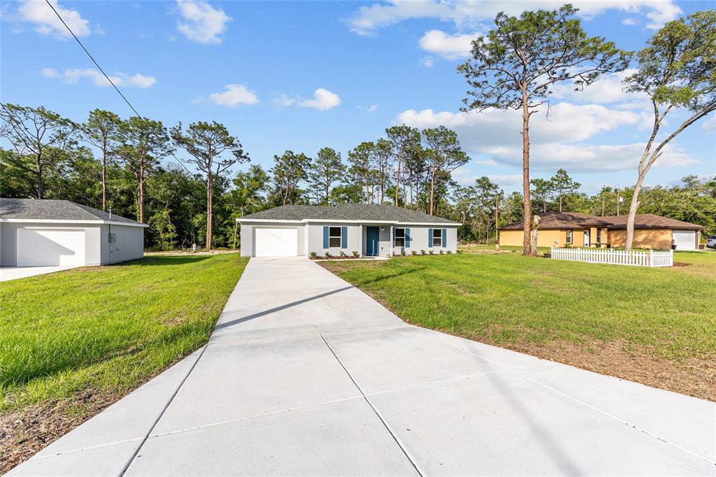 360 Locust Road Ocala, FL 34472 - Photo 5 of 48 a front view of house with a yard
