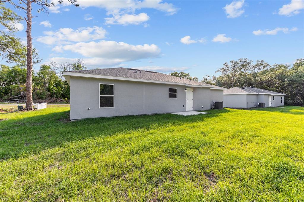 360 Locust Road Ocala, FL 34472 - Photo 7 of 48 a view of a house with a backyard